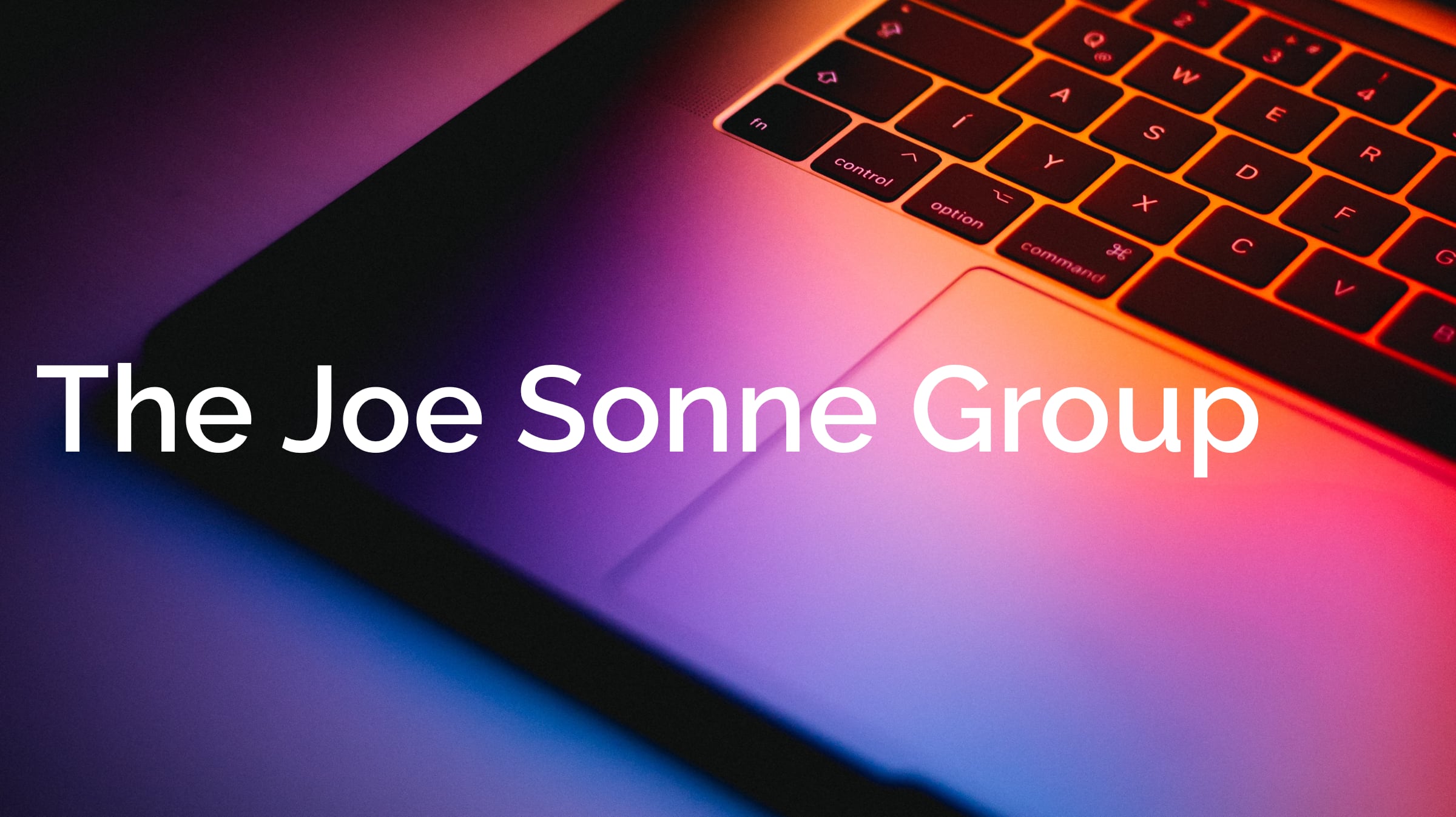 Decorative image of MacBook with The Joe Sonne Group title on it